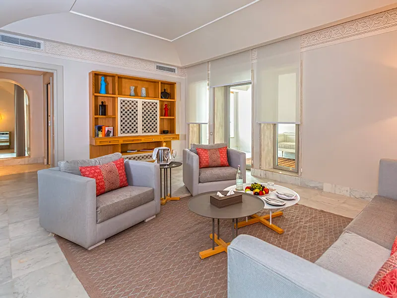 Bright Suite living room with grey armchairs and coffee table
